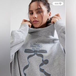 Brand New Never Worn Gray Graphic Hoodie with Bow Design